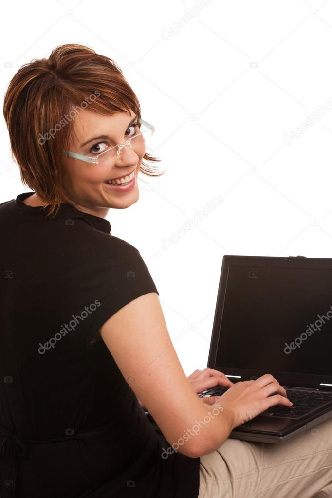 Friendly brunette female working on laptop