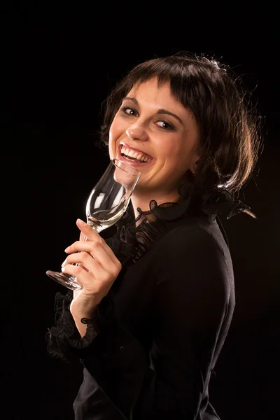 Young female brunette drinking wine and laughing — Stock Photo, Image