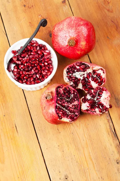 Delicious fresh pomegranate fruit on table — Stock Photo, Image