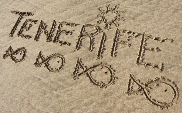 テネリフェ島の砂のエル パパガヨ ビーチに書く ストックフォト