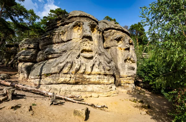 Devil\'s Head (Certovy Hlavy), two faces carved in sandstone rocks, Kokorin Forest, Village Zelizy, Czech Republic.