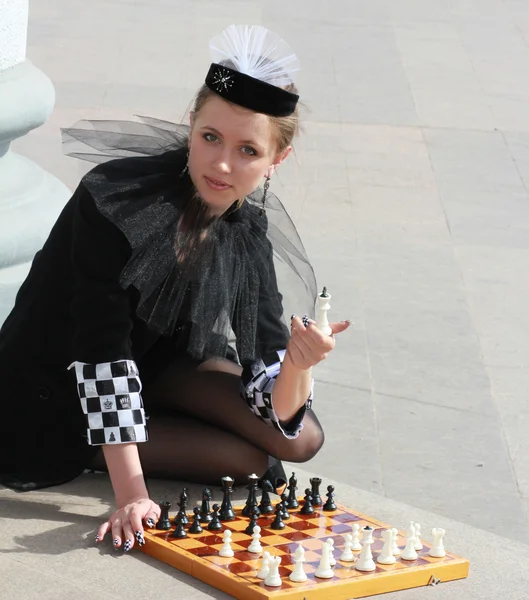 The girl in a hat and with chess manicure — Stock Photo, Image