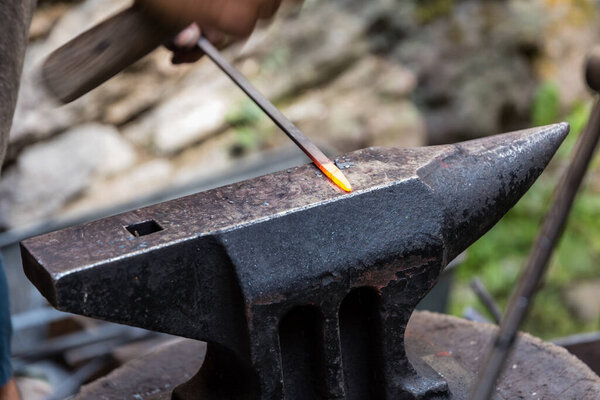 Blacksmiths - old craftsmanship of metalworking on the anvil, detail