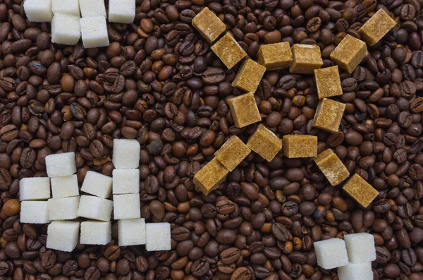 Funny composition of sugar in the form of a sun and clouds on the background of coffee beans Royalty Free Stock Photos