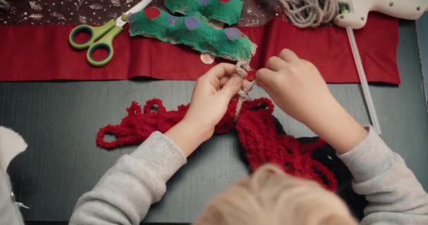 Closeup child hands making craft diy Christmas gift — Stockvideo