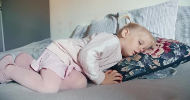 Cute toddler girl is sleeping in living room at the day — Stock Video