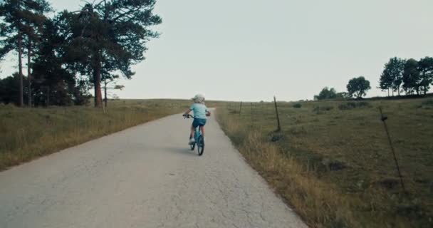 Wide Open Footage Camera Follow Child Ride Bicycle Empty Country — Stock Video