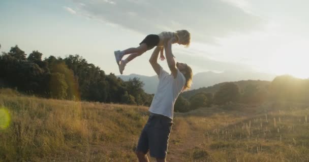 Happy Father Holding His Daughter Hands Himself Spinning Smiling Girl — Vídeo de stock