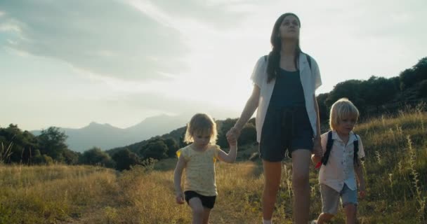 Female Traveler Holding Children Hand Summer Vacation Trip Family Hiking – stockvideo
