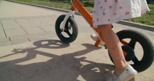 Toddler Girl Dress Drive Bike Sunny Summer Day Carefree Childhood — стоковое видео