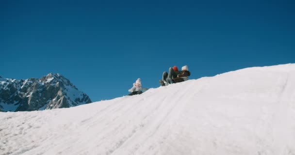 Traveler Man Children Winter Vacation Travel Slide Snow Hill His — Stock video