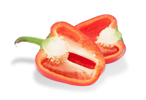 Twee rode paprika, gesneden een, geïsoleerd — Stockfoto