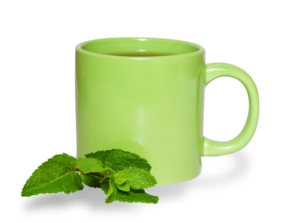 Green cup of tea and mint leaves isolated — Stock Photo, Image