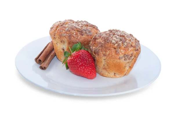 Two muffin, strawberry and cinnamon sticks on brown plate — Stock Photo, Image