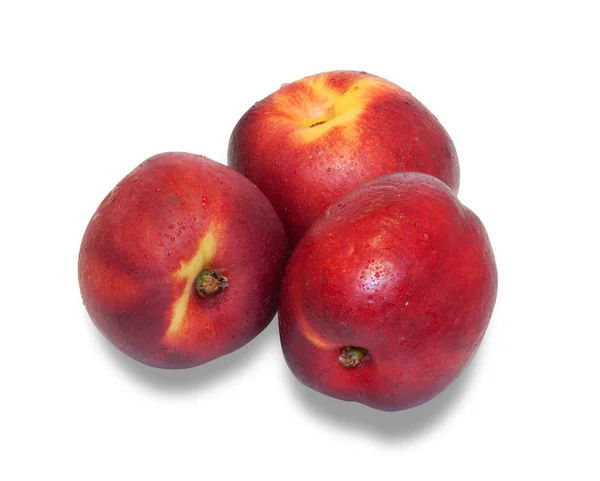 Drie rijpe nectarine geïsoleerd — Stockfoto