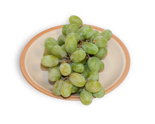 Green grapes on brown dish isolated — Stock Photo, Image