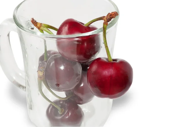 Bunch of cherries in clear glass isolated — Stock Photo, Image