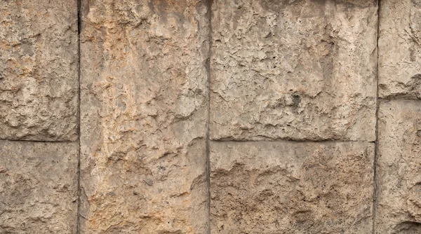 Textur der alten gelben Steinmauern — Stockfoto