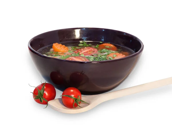 Vegetarian soup with cherry tomatoes and herbs in black bowl iso — Stock Photo, Image