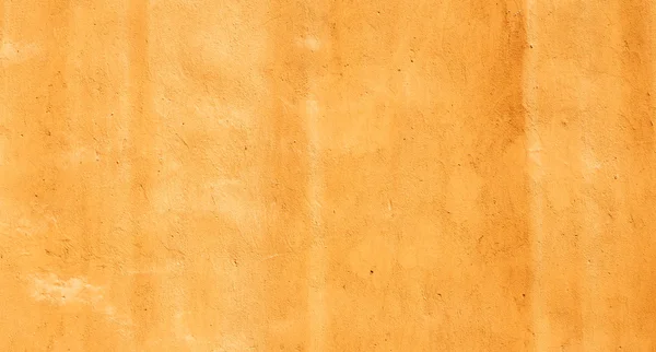 Текстура старых желтых штукатуренных стен — стоковое фото