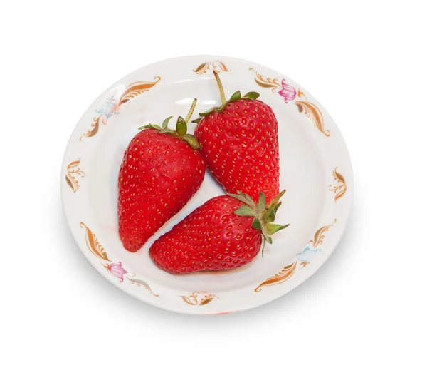 Three red strawberries on white platter isolated — Stock Photo, Image