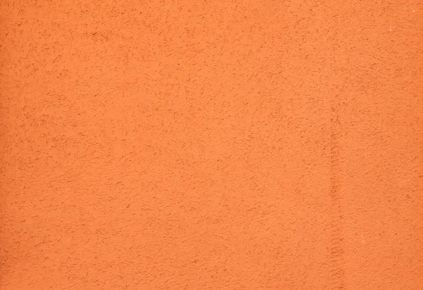 オレンジ色の壁を漆喰の質感 — ストック写真