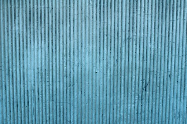 Tekstury ścian pokryte tynkiem z niebieski pionowy ulgi — Zdjęcie stockowe