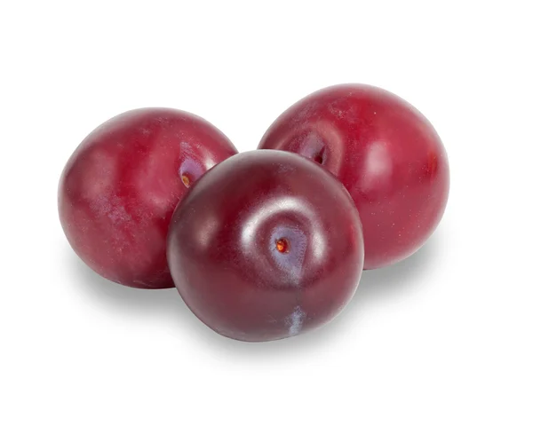 Three ripe crimson plum isolated on white with shadow — Stock Photo, Image