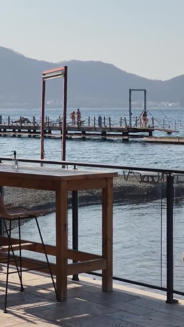 Turkey, Marmaris, 03 October 2021: The picturesque bay of many islands near Marmaris, girls are resting on the pier, mountains on background — Stock Video