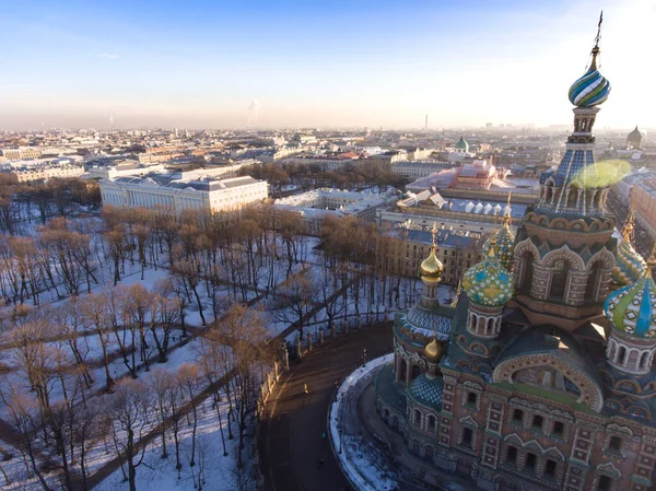 Russia, Saint-Petersburg, Aerial view of the cathedral Church of the Savior on Blood and Russian Museum of Arts at sunset, golden domes, roofs, winter landscape — Stock Photo, Image