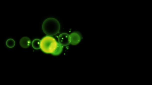 アニメーション緑の光が黒の背景に輝く — ストック動画