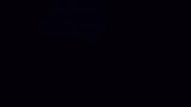 Realistic purple lightning on black background.