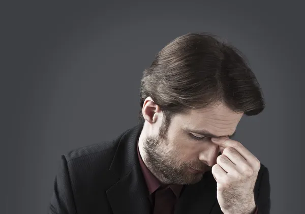 Forty years old depressed and overwhelmed businessman with his head down. Office worker under pressure or mobbing concept. — Stock Photo, Image