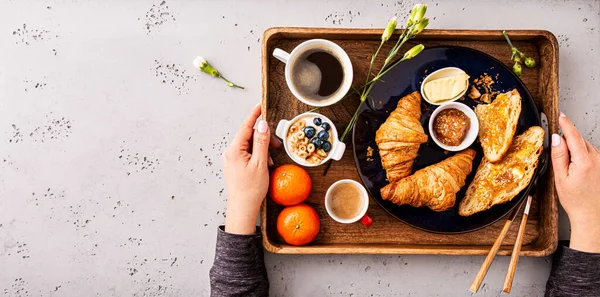 Woman Serving Continental Breakfast Wooden Tray Coffee Croissants Jam Butter — Stock Photo, Image