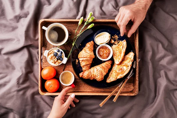 Couple Eating Continental Breakfast Rustic Wooden Tray Bed Grey Sheets — Stock Photo, Image