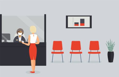 Virüs salgını sırasında banka ofisi açıktır. Tezgahın arkasındaki koruyucu tıbbi maske çalışanı müşteriye hizmet eder. Müşteri kasanın yanındaki koridorda durur ve tezgahtarla konuşur.