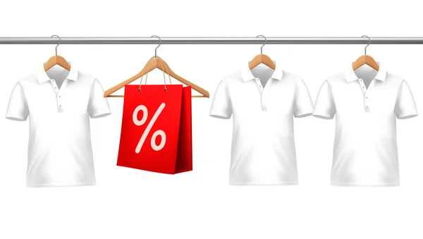 Shirts with price tags hanging on hangers. Concept of discount s — Wektor stockowy