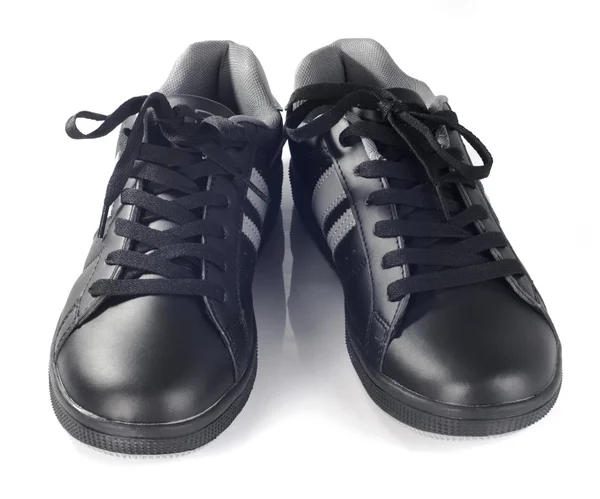 Schwarze neue Turnschuhe — Stockfoto