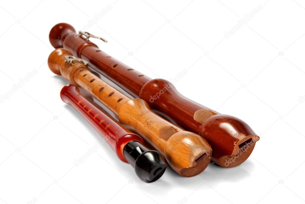 Three old battered wooden recorders