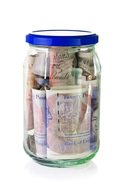 Βρετανικές λίρες τραπεζογραμματίων σε ένα ποτήρι βάζο — Φωτογραφία Αρχείου