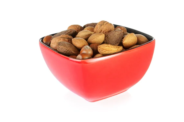 Skål med blandade nötter som innehåller mandlar, hasselnötter, valnötter och br — Stockfoto