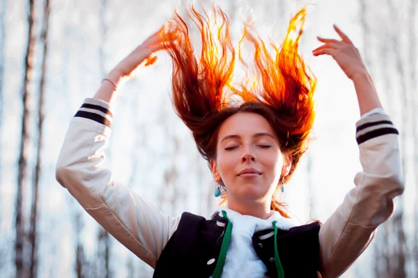 Portrait of a beautiful red-haired (ginger) girl with flying hair. — Stock Photo, Image