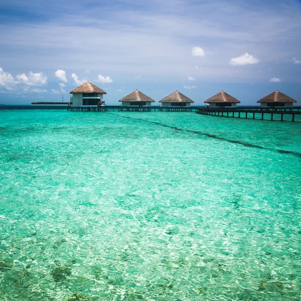 Over water bungalows with steps into amazing green lagoon — Stock Photo, Image