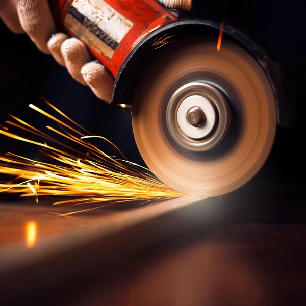 Worker cutting metal with grinder — Stock Photo © VolodymyrBur 23448526