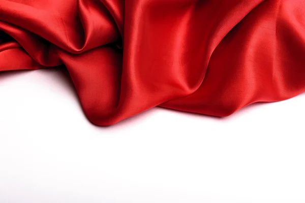 滑らかなエレガントな赤い絹は背景として使うことができます — ストック写真