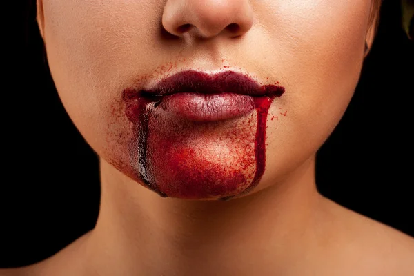 Closeup of Red lips of a young girl, with blood flowing by. — Stock Photo, Image