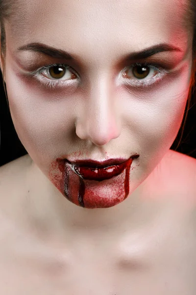 Closeup of Red lips of a young girl, with blood flowing by. — Stock Photo, Image