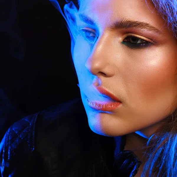 Woman with Cigarette Exhaling Smoke  on a Dark Background — Stock Photo, Image