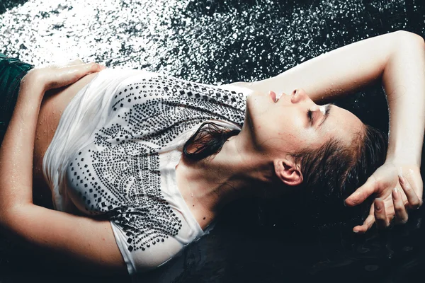 Sexy woman lying in aqua studio — Stock Photo, Image