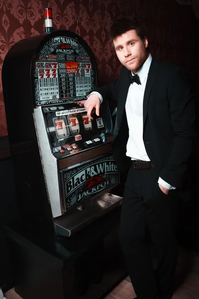 Man playing at the casino — Stock Photo, Image